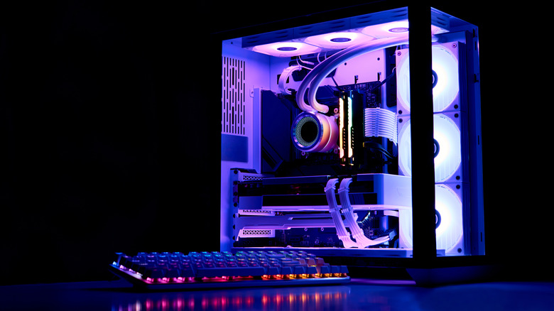 A PC with a glass case and rainbow lighting