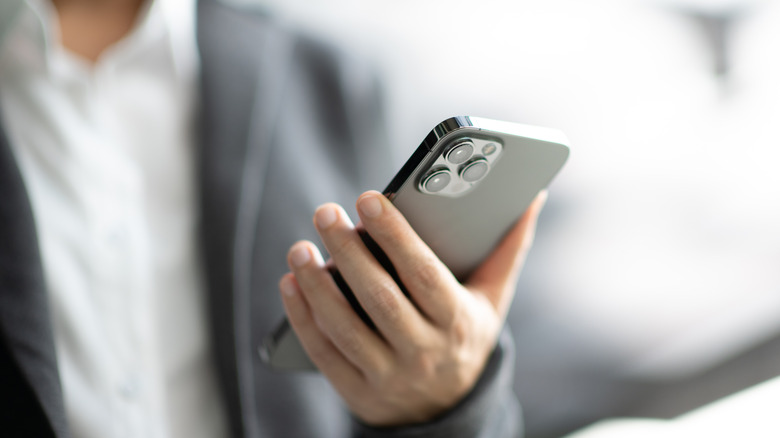 professional using an iphone 12