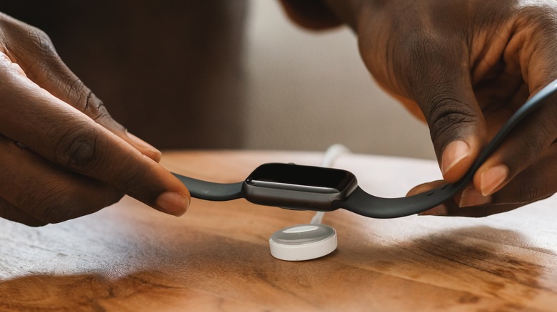 Placing Apple Watch on charger