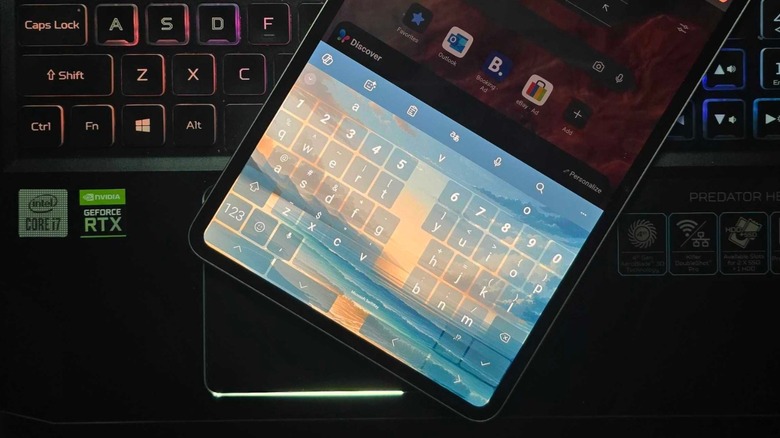 an Android tablet featuring a custom keyboard