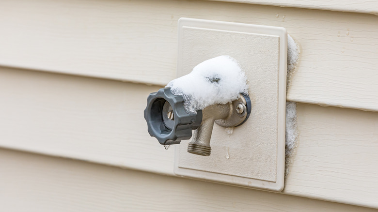 Snow melting on an uncovered outdoor faucet