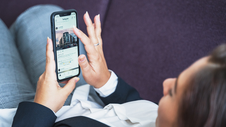 woman browsing Instagram main feed