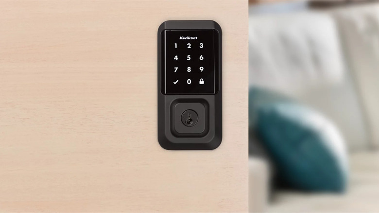Kwikset Halo smart lock on door with living room in the background