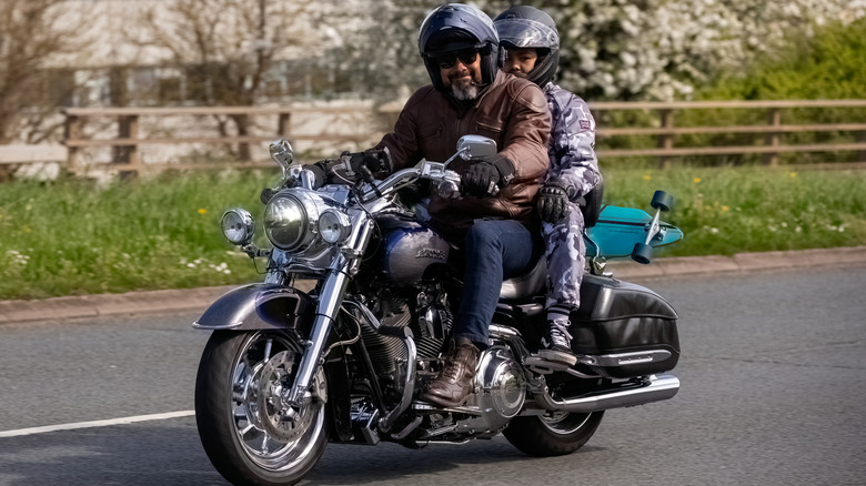 Two riders on a motorcycle.