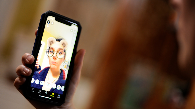 Snapchat user on smartphone