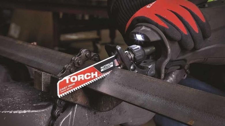 Torch sawzall blade cutting through metal