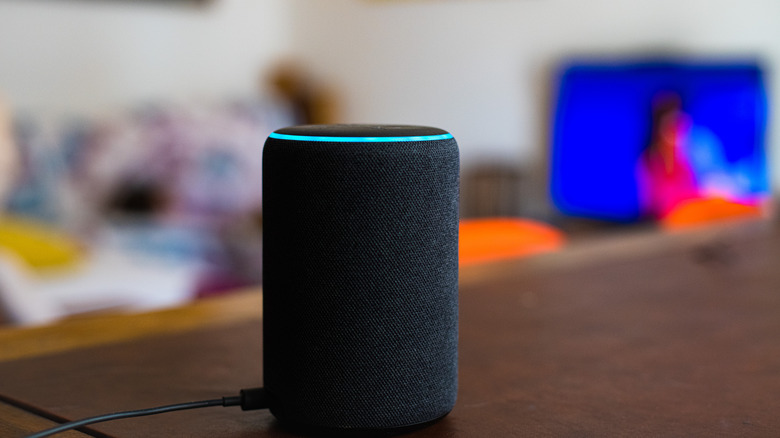 Echo smart speaker on a table with alert ring activated
