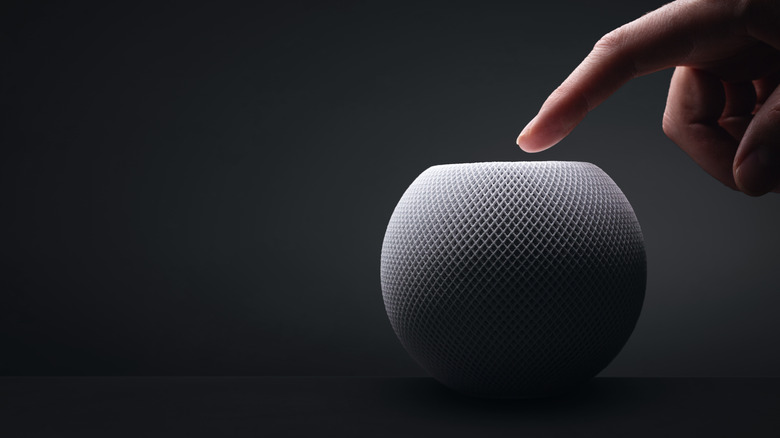 Finger touching HomePod