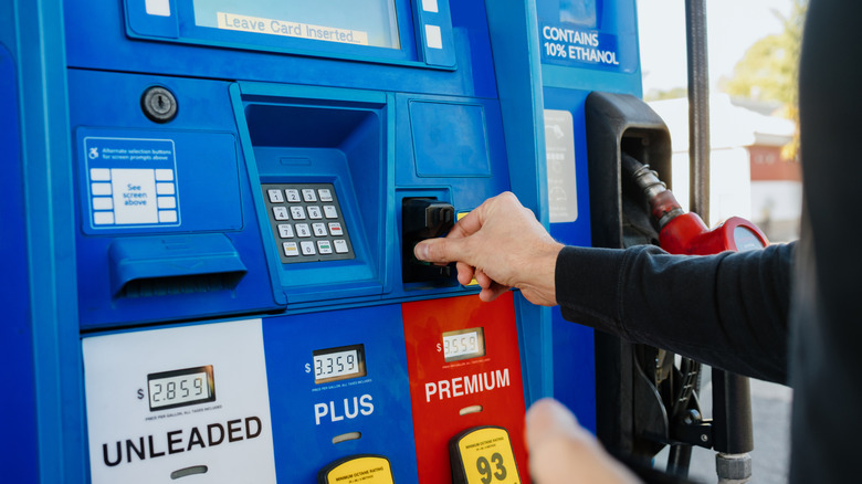 Customer using credit card to pay for gas at the gas pump