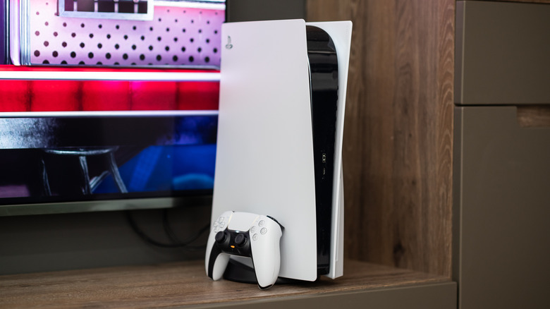 PlayStation 5 console and remote near a TV