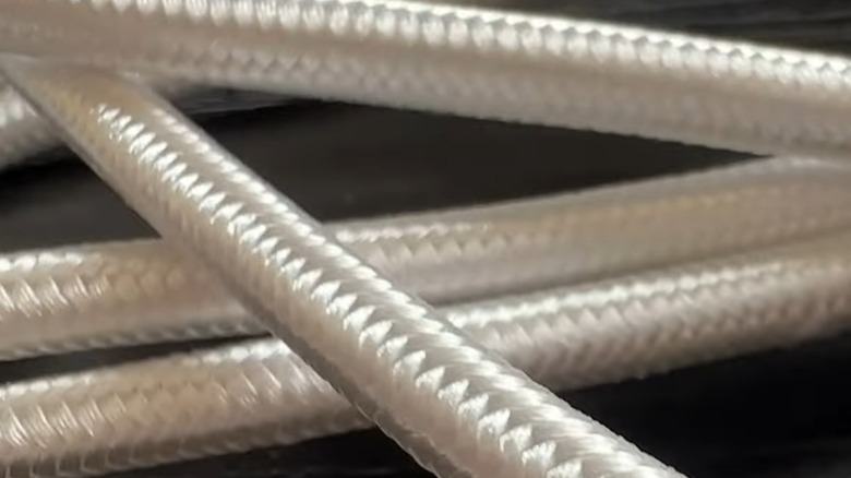 Braided white cables stacked on top of each other