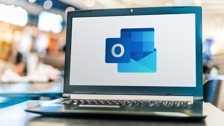 Laptop screen displaying Outlook logo