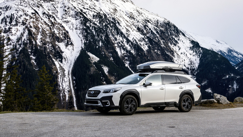 Subaru Outback parked on mountain cliffside