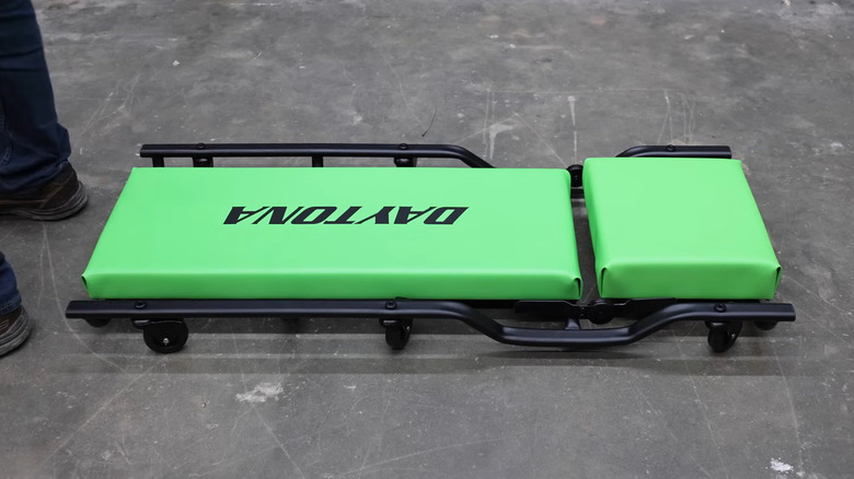 Green Daytona branded creeper on a workshop floor