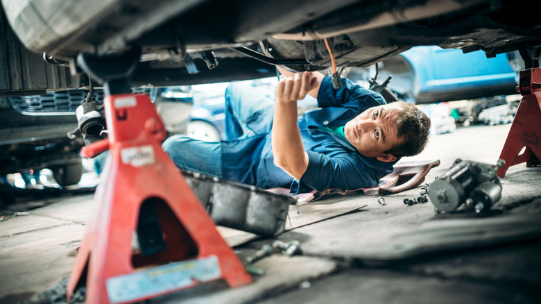 Mechanic working on vehicle