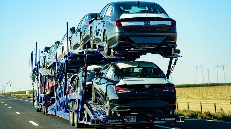 Truck carrying Hyundais on the freeway
