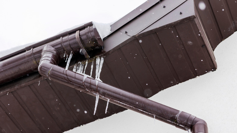 Ice Dam in Gutter of Roof House