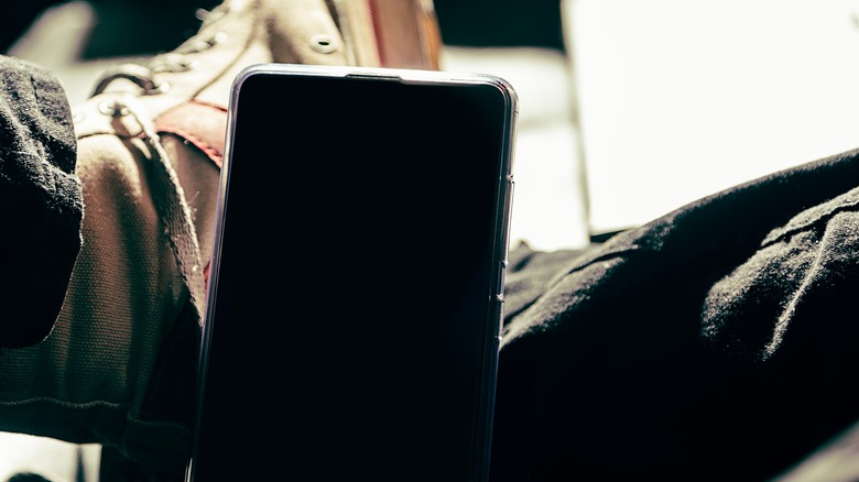 phone propped up on shoes