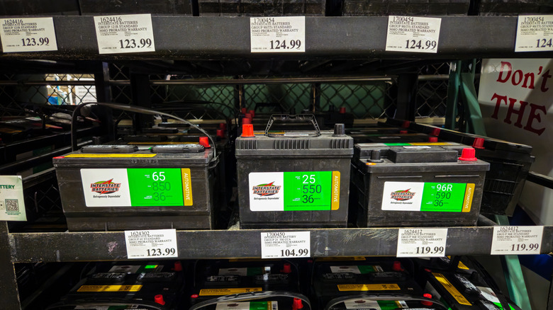 Interstate batteries on a shelf with their price tags