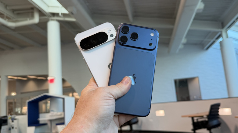Man holding iPhone 17 Pro Max and Pixel 10 Pro XL