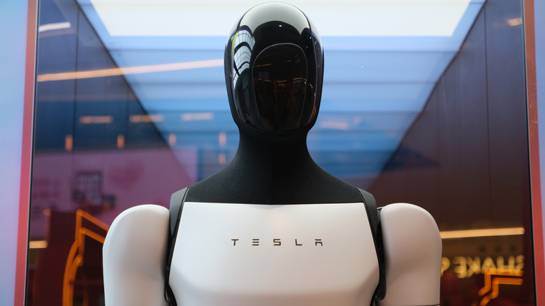 Tesla Optimus robot visible through window