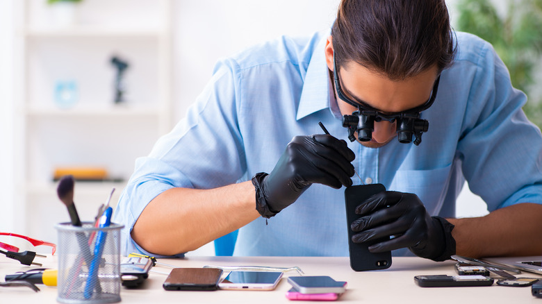 guy fixing a phone