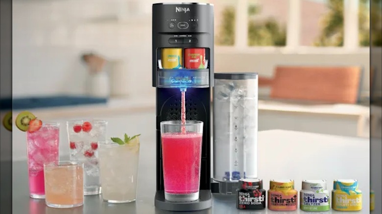 Ninja Thirsti in use with drinks and Flavor Drops beside it