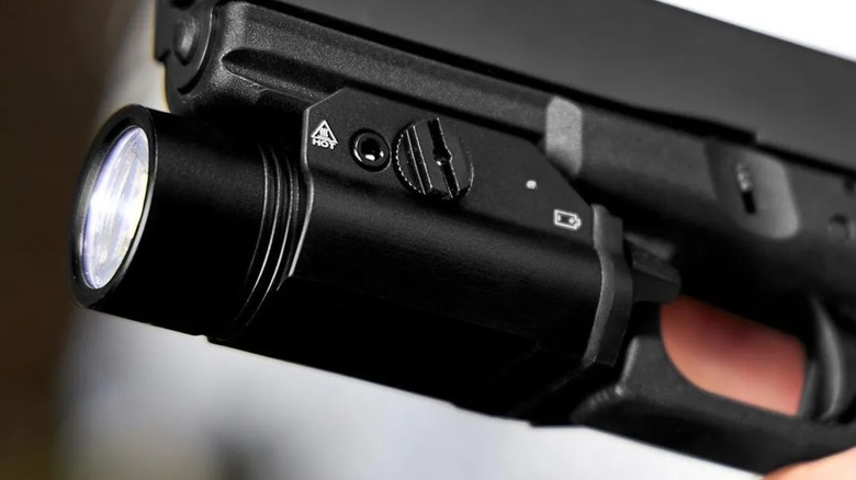 Low view of a Braun Tactical Light on a pistol