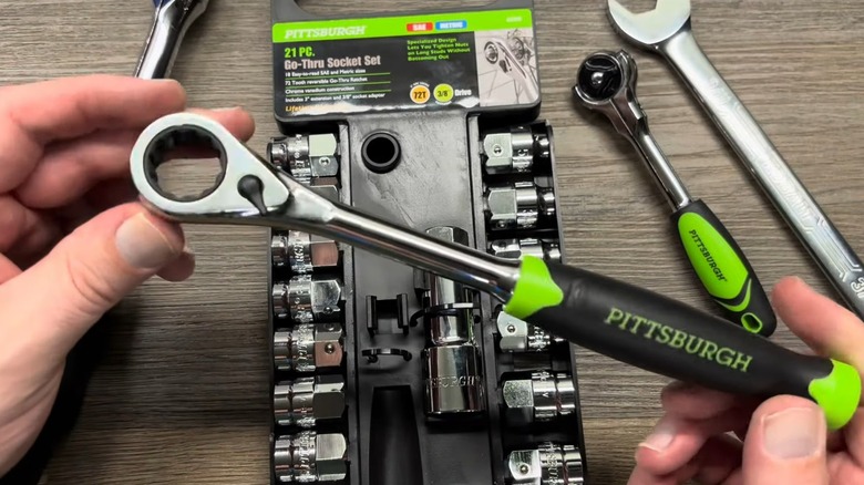 A person holding a Pittsburgh socket wrench.