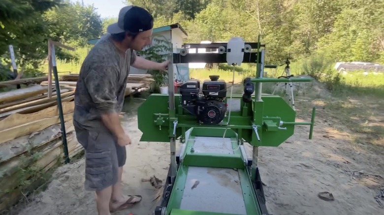Person showing the rear view of Central Machinery Saw Mill and motor