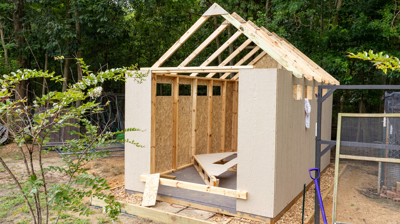 A half-built shed in a back yard