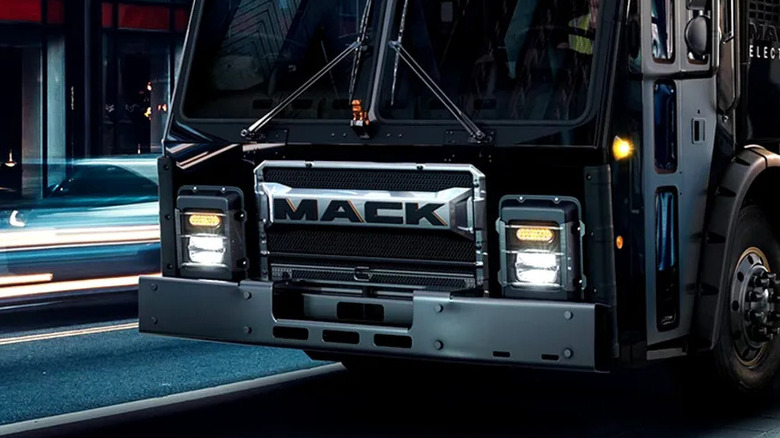 Mack name in front of Mack Truck on the street