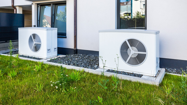 Air source heat pumps outside a home.