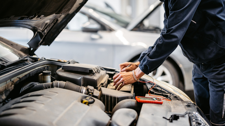 Man testing car battery