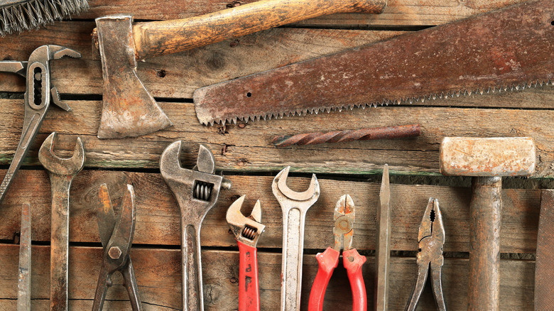 Old hand tool on a wooden surface