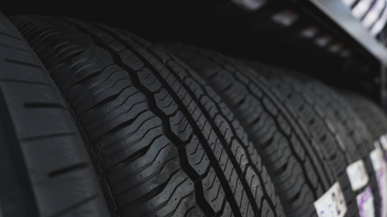 A row of new tires at a tire shop