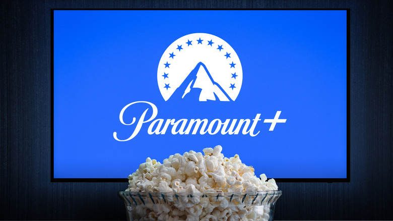 A bowl of popcorn sitting in front of a TV with the Paramount Plus logo