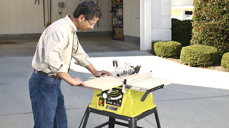 Person using Ryobi Table Saw