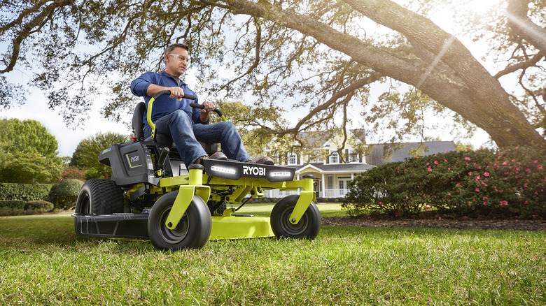man riding ryobi mower 