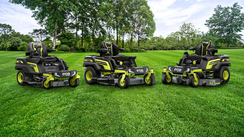 three mowers on yard 