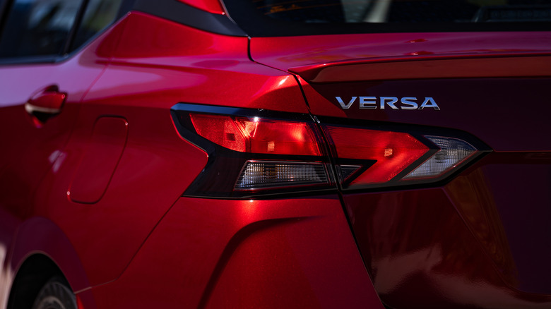 The rear of a red 2025 Nissan Versa
