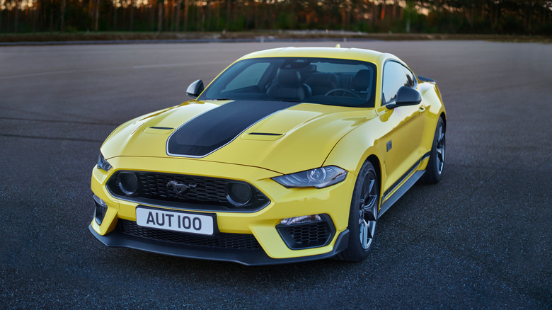 2021 Yellow Mustang Mach 1 parked in an open space