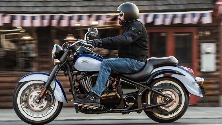 man with beard driving bike