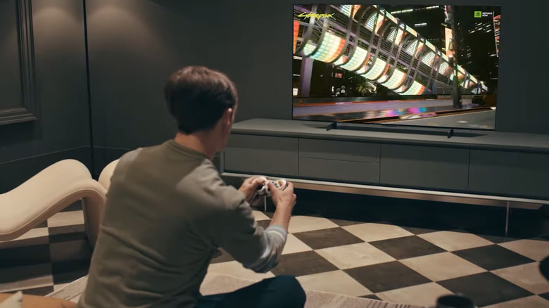 Person playing games on a LG OLED G4 TV