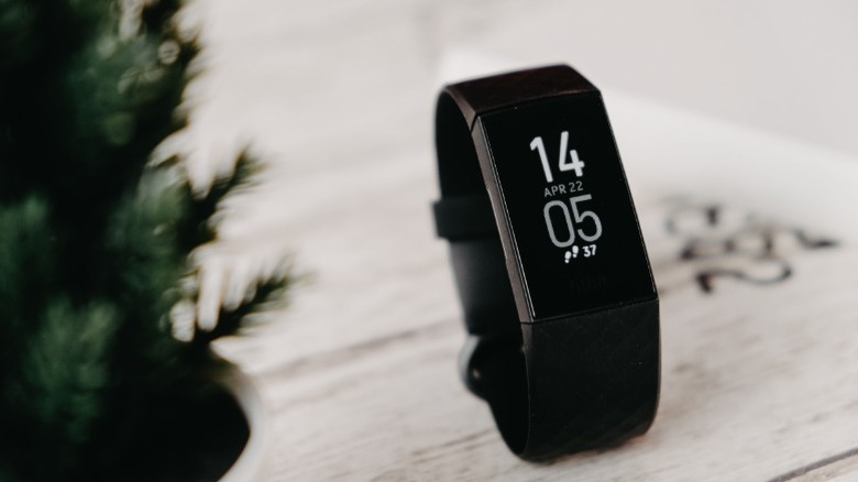 A fitness tracker displaying the time