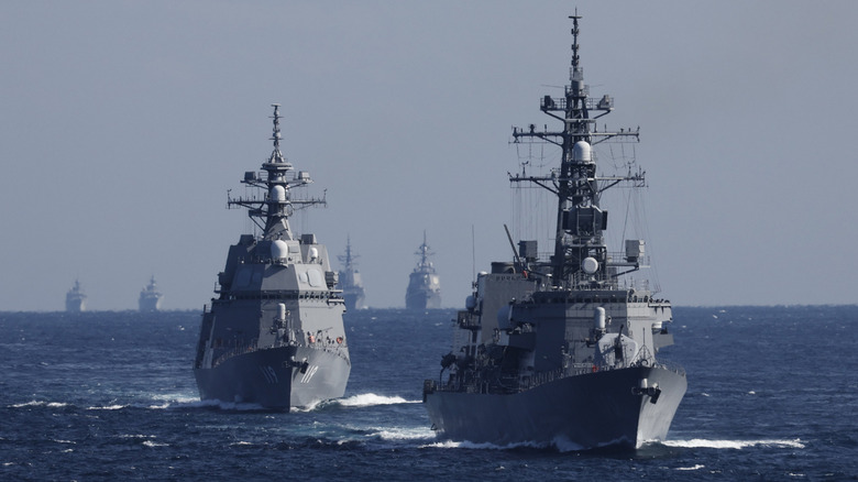 The Japan Maritime Self-Defense Force (JMSDF) destroyer Takanami leads a fleet during an International Fleet Review