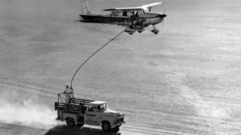 Image of the Cessna 172 flow by Robert Timm and John Cook refueling while setting the record for longest continuous flight.