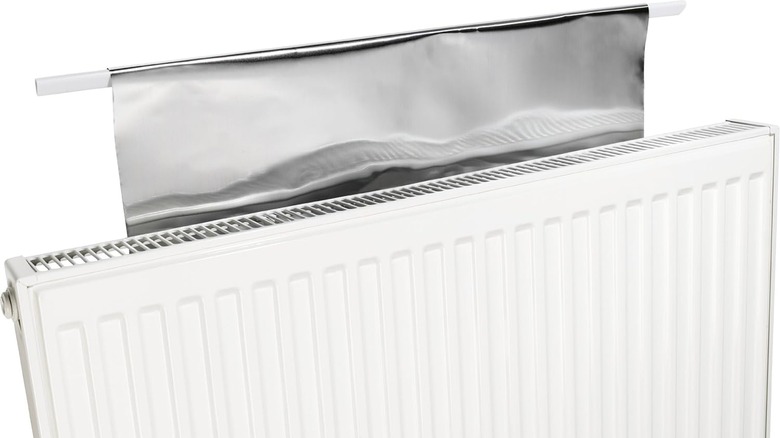 A radiator with a heat reflector installed