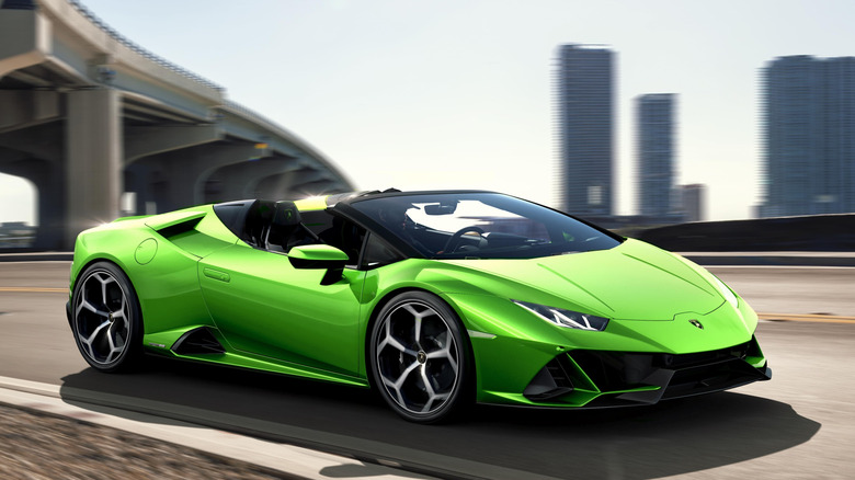 A green Lamborghini Huracán EVO Spyder in urban setting