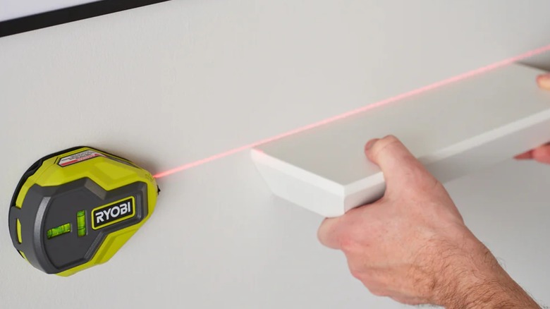 Ryobi 20-Foot AirGrip Laser Level measuring a shelf